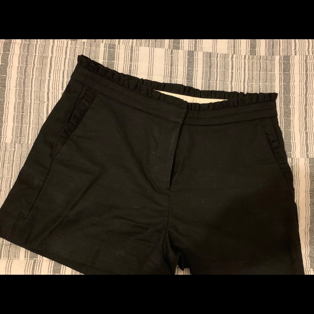 Black scallop-edged shorts